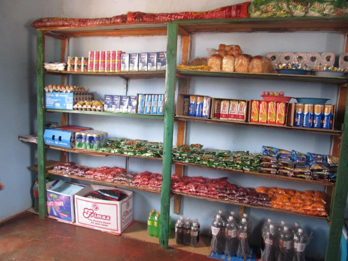 A fully stocked tuckshop being managed by child protection committee members