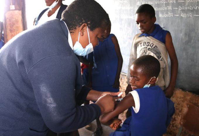 A grade 5 pupil gets a Measles shot
